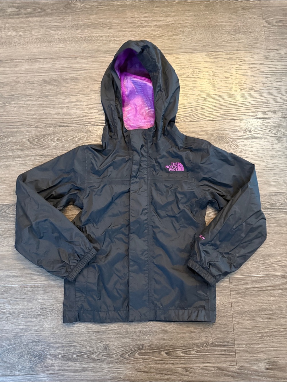 The North Face Black Rain Jacket with Purple Lining size 6 Kids